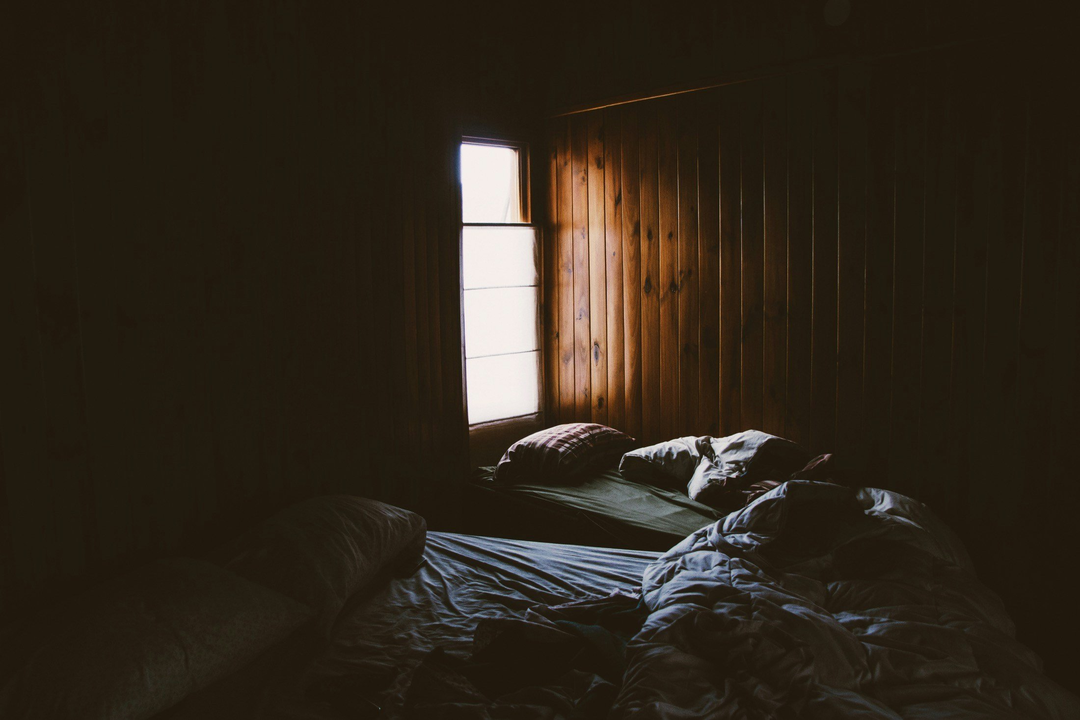 Cozy bedroom setup featuring a hybrid mattress with proper pillows and bedding